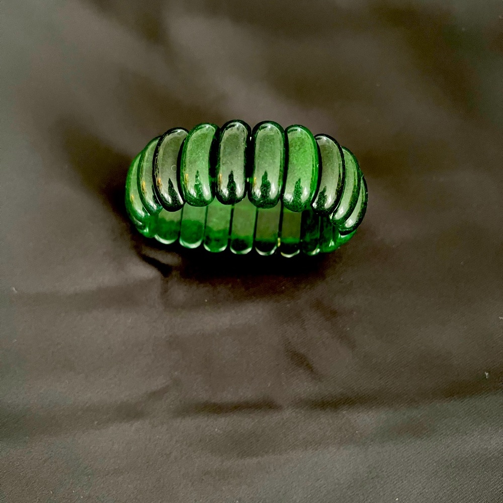 Green stone/need bracelet . Flexible with elastic to fit your wrist